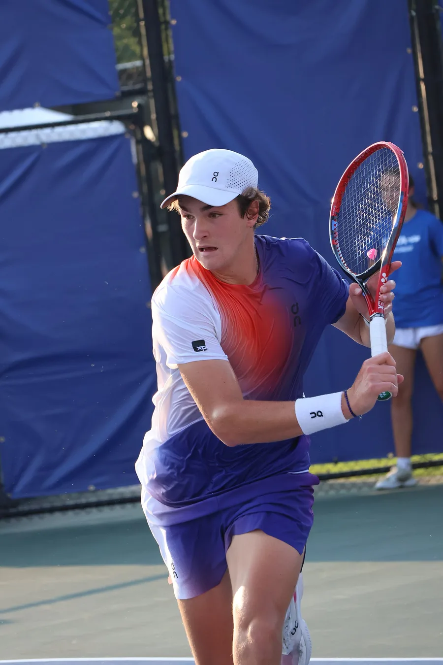 João Fonseca playing a backhand during a 2024 match in Cary, North Carolina